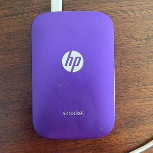 HP sprocket with pack of photo sheets, plus some unused still inside